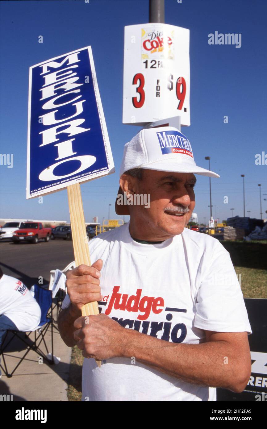 Laredo, Texas USA, 2002: Supporters of Democratic candidate for county judge brandish signs on election day. ©Bob Daemmrich Stock Photo