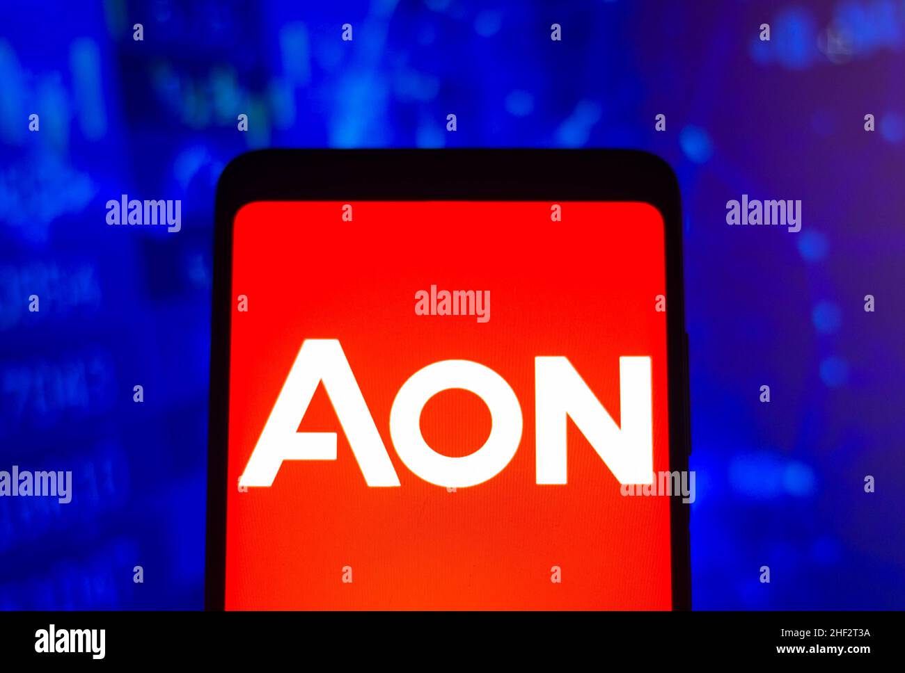 In this photo illustration, an Aon plc logo is seen displayed on a ...