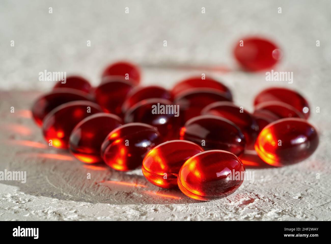 Krill oil pills or softgells on white background - healthy nutritional supplement rich in omega-3 Stock Photo