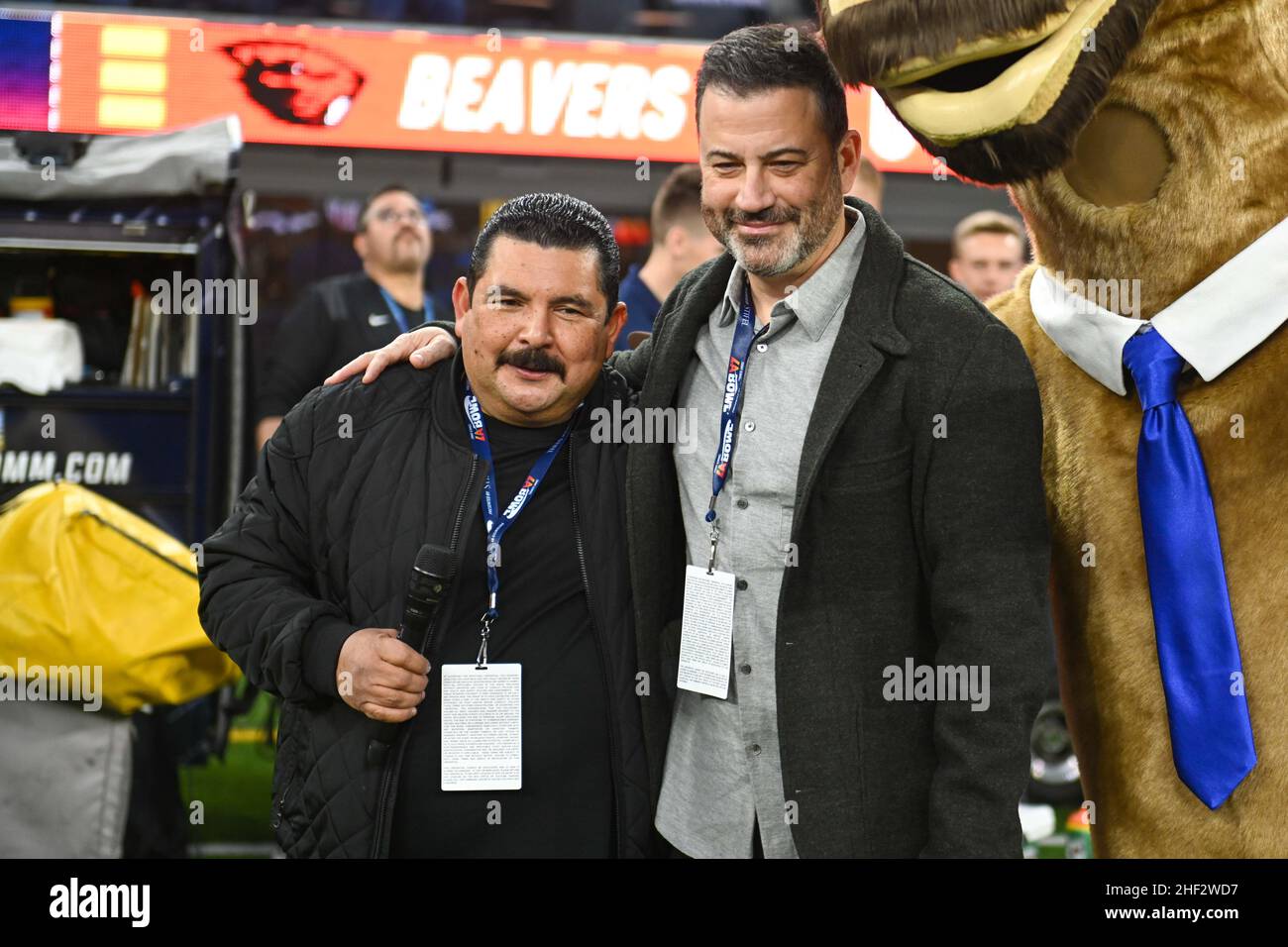 American television host Jimmy Kimmel embraces Guillermo Rodriguez during the LA Bowl game, Saturday, Dec. 18, 2021, in Los Angeles. The Utah State Ag Stock Photo