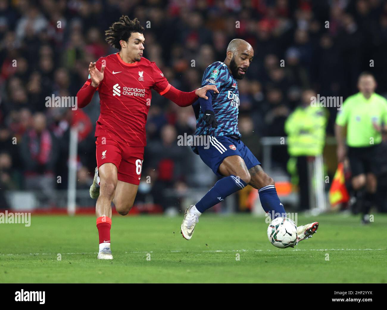 Liverpool, UK. 13th Jan, 2022. Alexandre Lacazette of Arsenal (R) is challenged by Trent Alexander-Arnold of Liverpool during the Carabao Cup match at Anfield, Liverpool. Picture credit should read: Darren Staples/Sportimage Credit: Sportimage/Alamy Live News Stock Photo