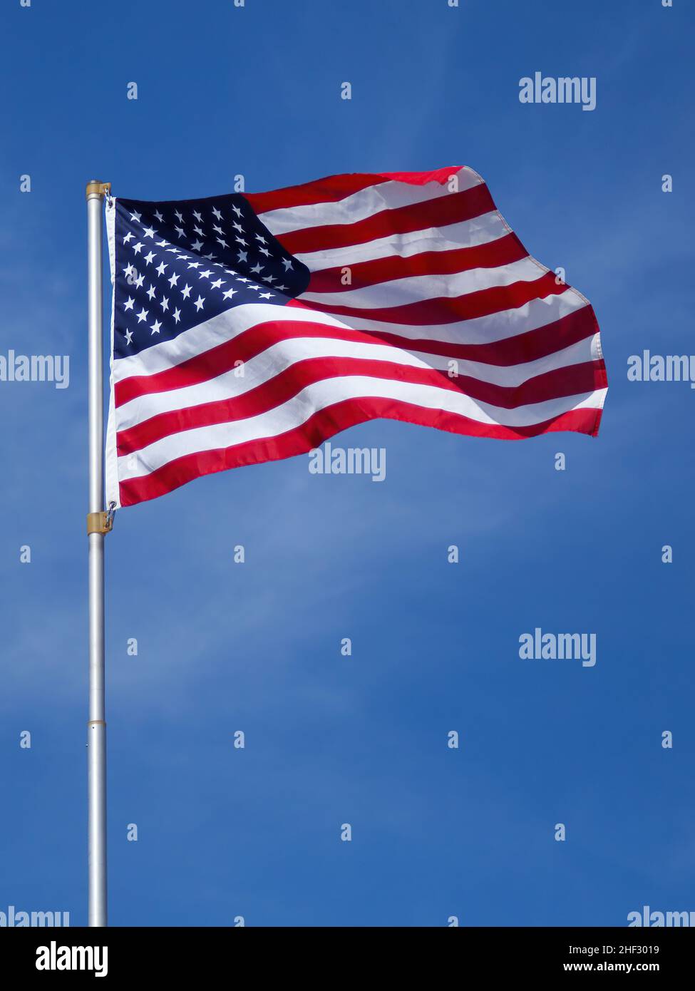Us flag against a blue sky hi-res stock photography and images - Alamy