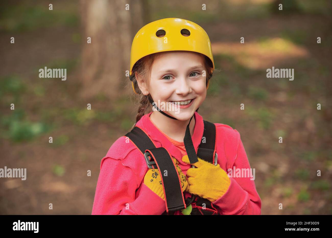 Go Ape Adventure. Child. Playground. Rope park - climbing center. Kid climbing trees in park. Climber child on training. Balance beam and rope bridges Stock Photo
