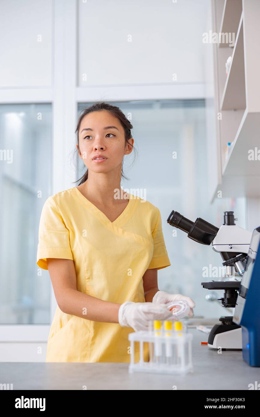 Laboratory assistant is conducting research in clinic Stock Photo Alamy