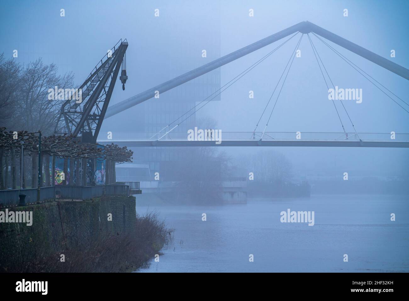 Dense fog, winter weather, bridge at the media harbour in DŸsseldorf, NRW, Germany Stock Photo