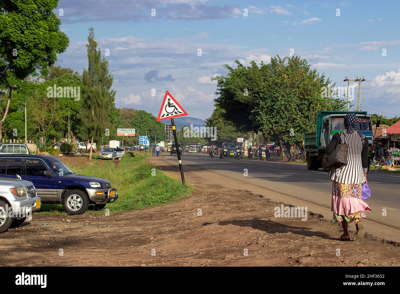 Road through the market and the transition for the disabled in the area of Arusha in Tanzania, 12 17 2021 Stock Photo