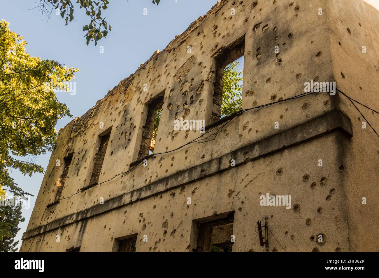 War damaged building with bullet holes in Mostar, Bosnia and ...