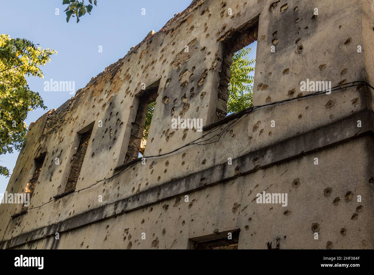 War damaged building with bullet holes in Mostar, Bosnia and ...
