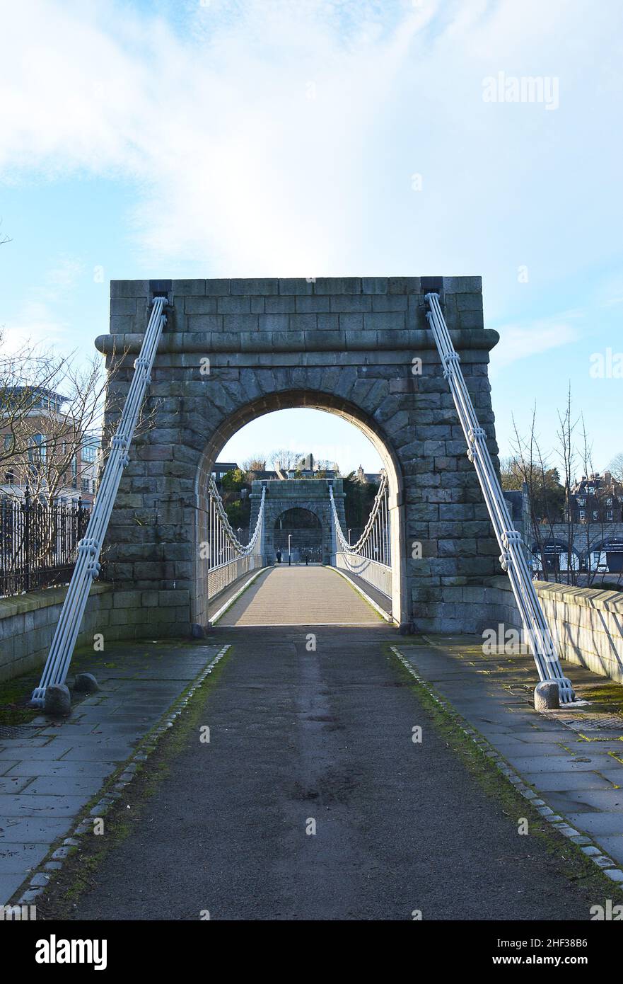 The Wellington Suspension Bridge over the River Dee in Aberdeen, Scotland opened in 1830. It was closed to vehicles in 1984 and to pedestrians in 2002 Stock Photo