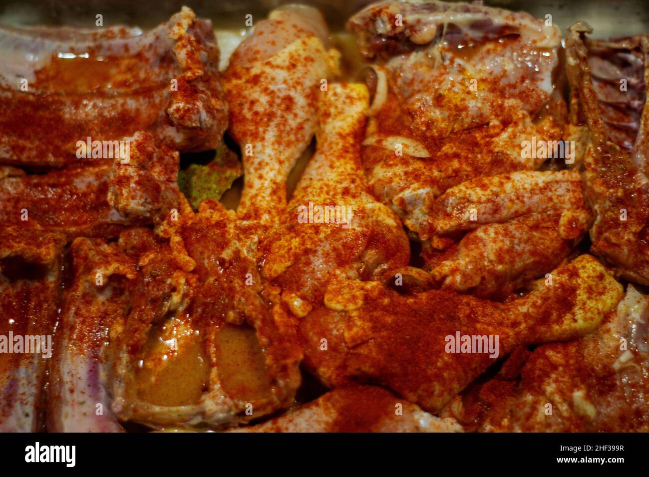Preparing chicken roast with flavored sauces. Marinating chicken meat for coocking Stock Photo