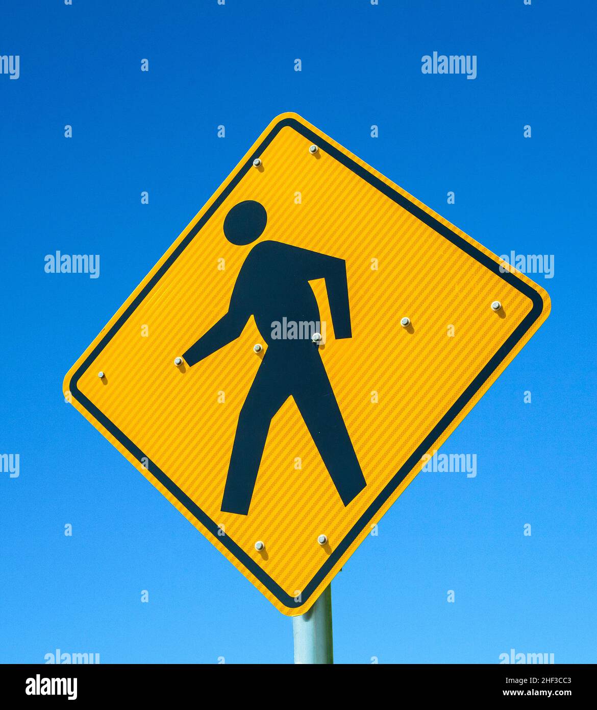 The Pedestrian crossing sign under blue sky Stock Photo Alamy