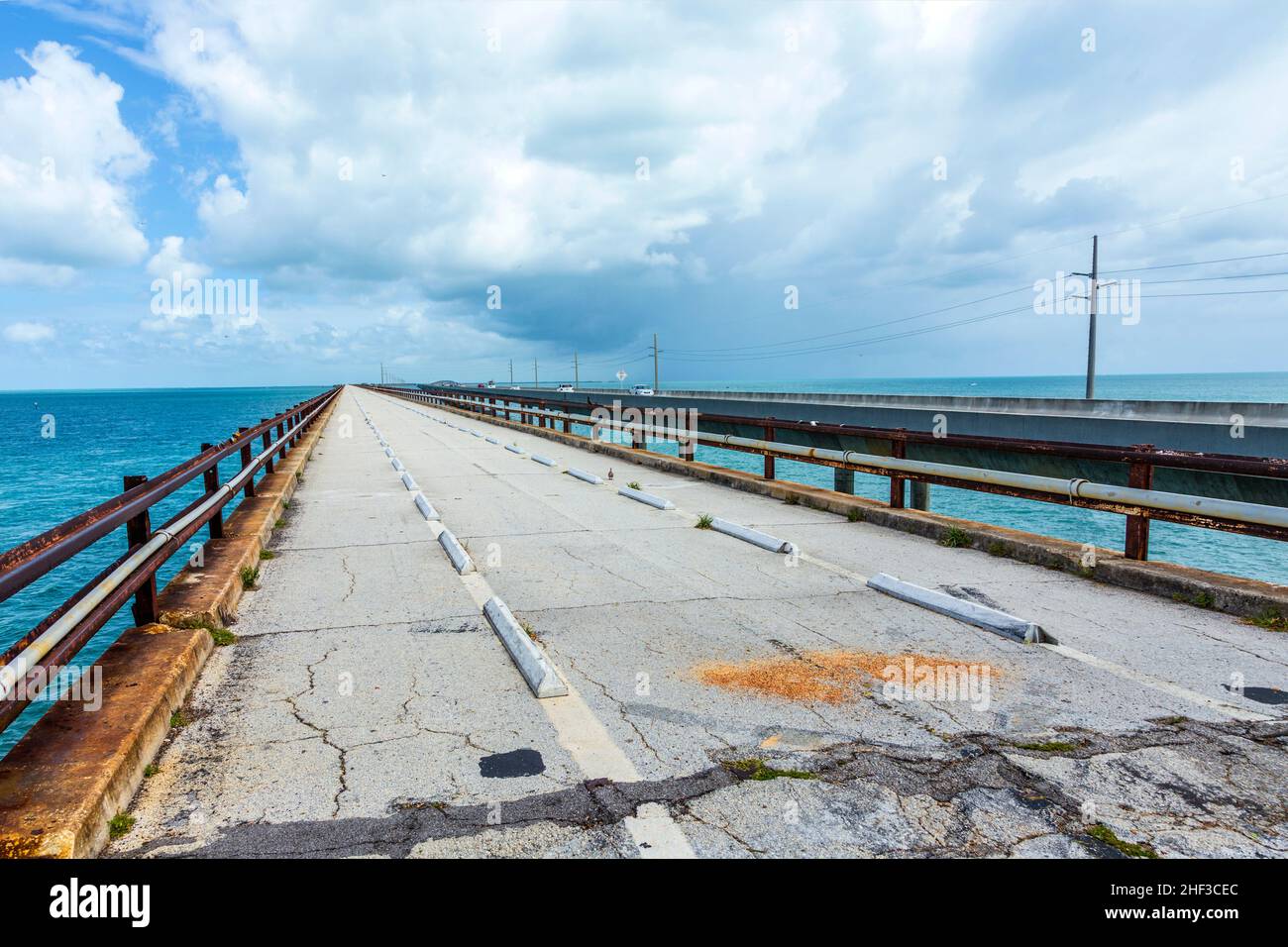 old part of the seven miles bridge under cloudy sky Stock Photo - Alamy