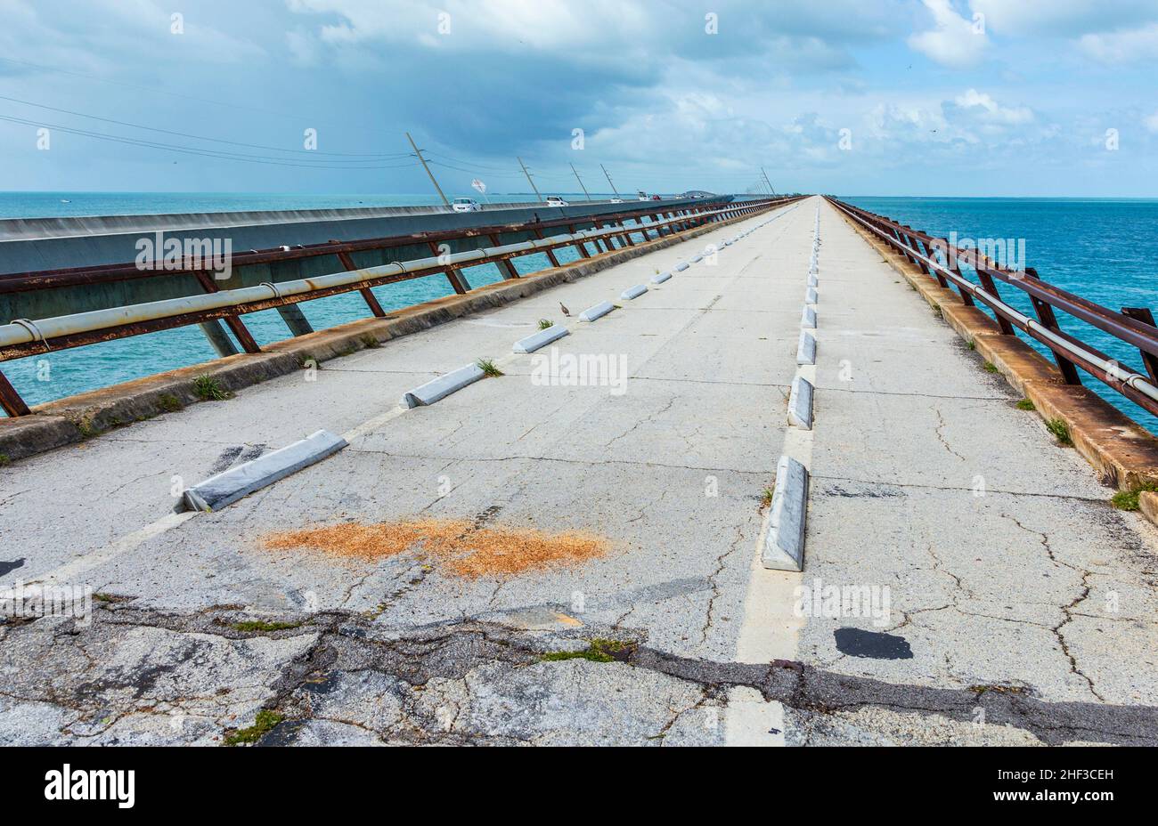 old part of the seven miles bridge under cloudy sky Stock Photo - Alamy