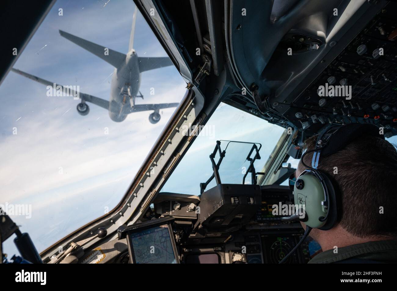 November 3, 2021 – Over the Gulf of Mexico near New Orleans, Maj. David Hutchins, a C-17 Instructor Pilot of the 183rd Airlift Squadron, 172nd Airlift Wing, Mississippi Air National Guard, aligns his aircraft for air-to-air refueling with a KC-46 tanker aircraft of the 157th Air Refueling Wing, New Hampshire Air National Guard.  The mission is in support of Operation Southern Lightning Strike 2021, an Air National Guard led exercise  where units deploy from their home bases to forward operating bases with minimum personnel and equipment to accomplish the mission in austere conditions. (U.S. Ai Stock Photo