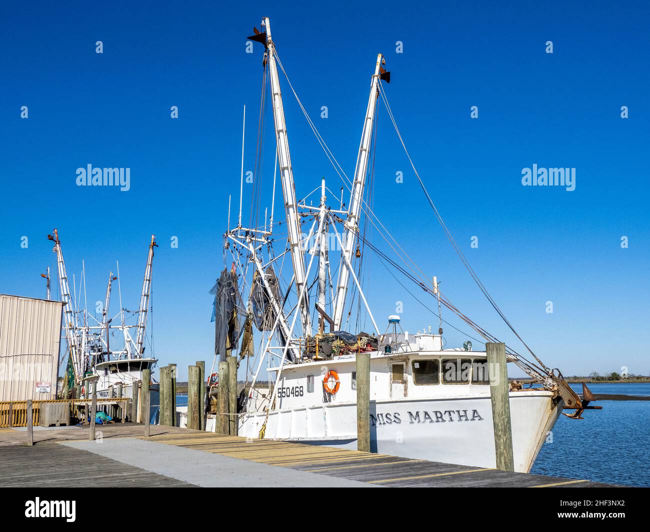 Shrimp boatat dock in Apalachicola River in Apalachicola in the panhandle area of Florida USA Stock Photo