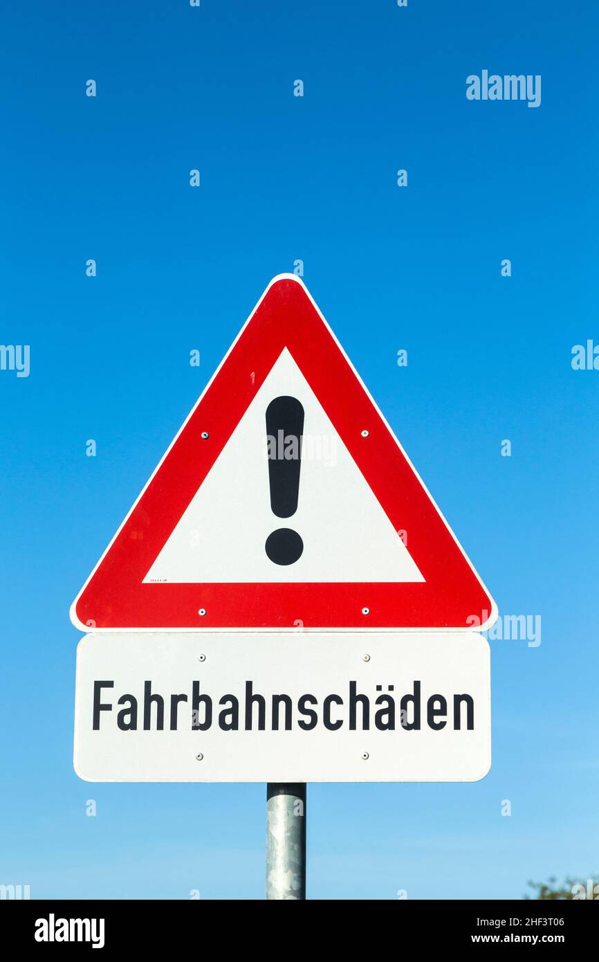 street sign - Street Damage - with warning icon under blue sky Stock ...