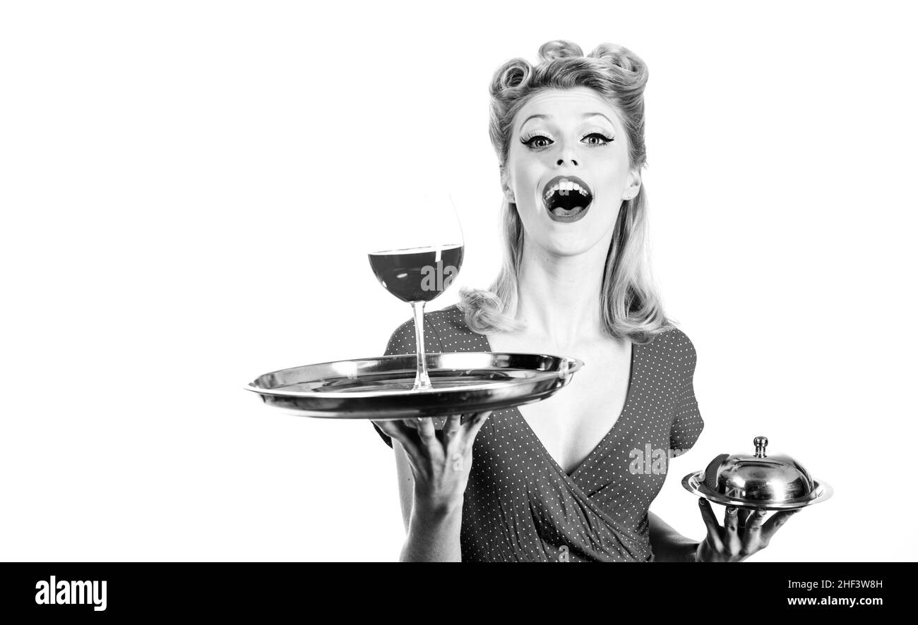 Woman with red wine. Alcohol presentation. Pin up waiter with wine and service tray. Restaurant serving. Studio isolated portrait. Stock Photo