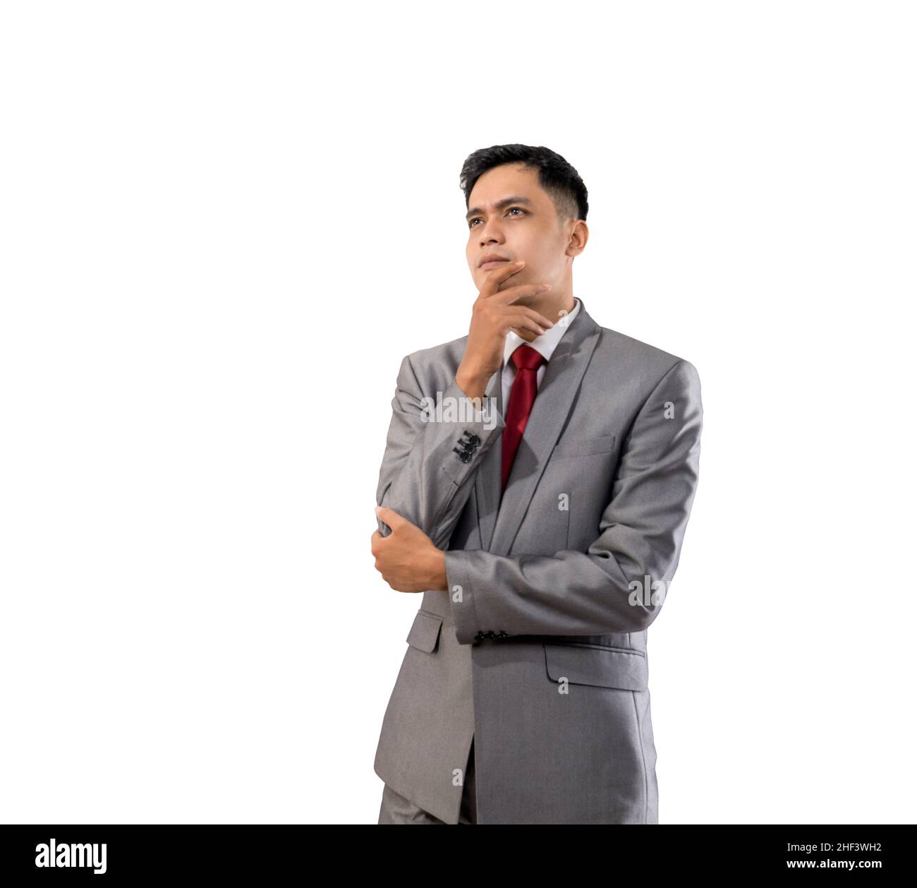 businessman thinking while looking up to copyspace Stock Photo