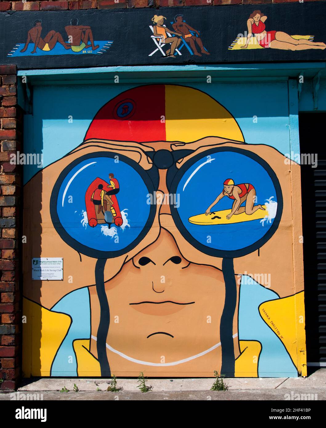 Street art mural by Daiana Ingleton depicting a lifesaver on watch in Black Rock on Port Phillip Bay, Melbourne Stock Photo