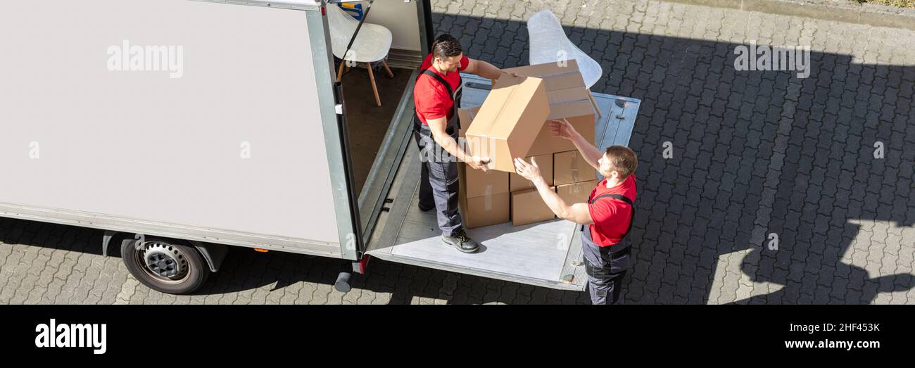 Furniture Removal Using Truck. Mover With Box Stock Photo Alamy