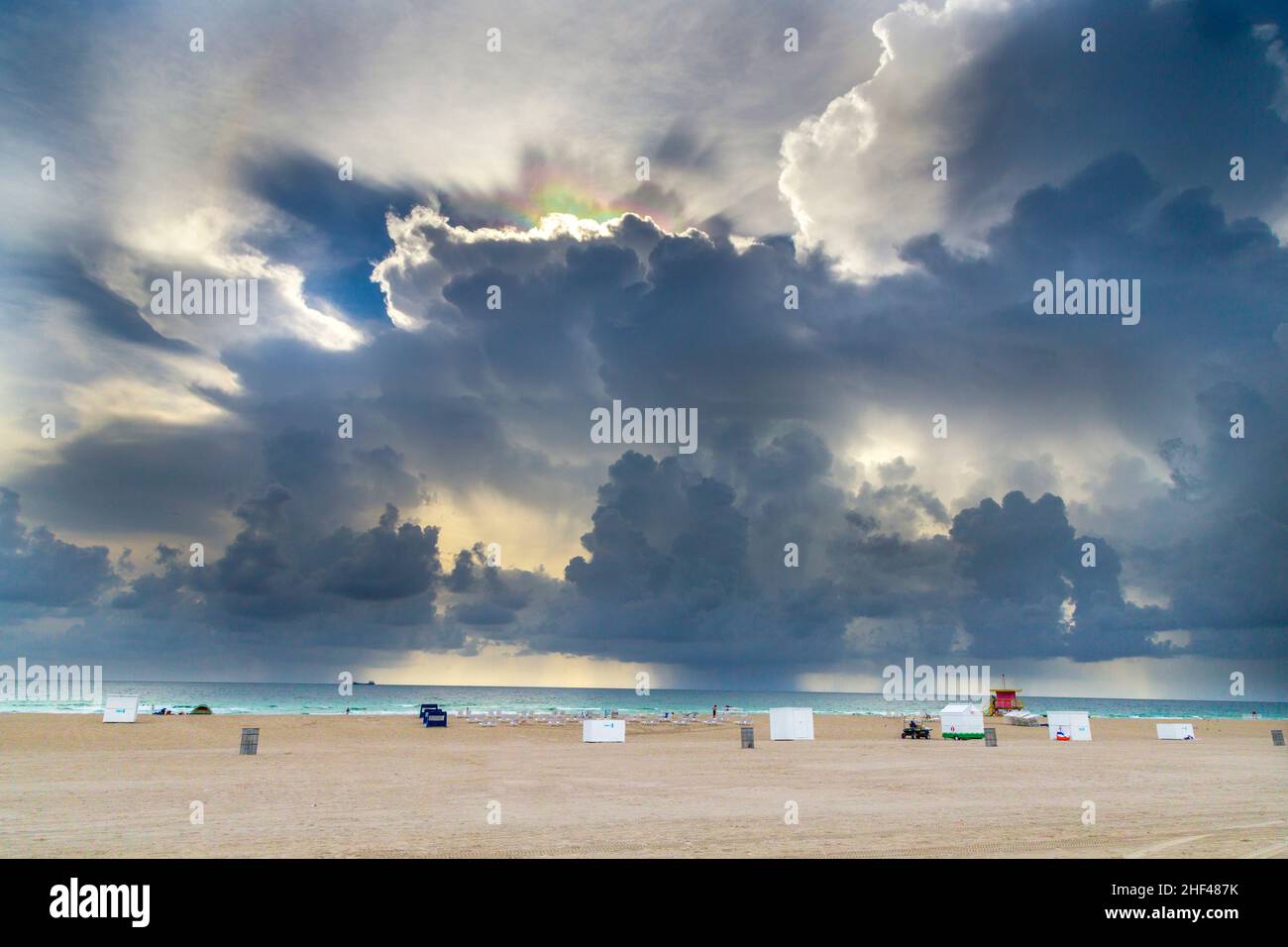 light refractions in the dark clouds at south beach in Miami Stock Photo