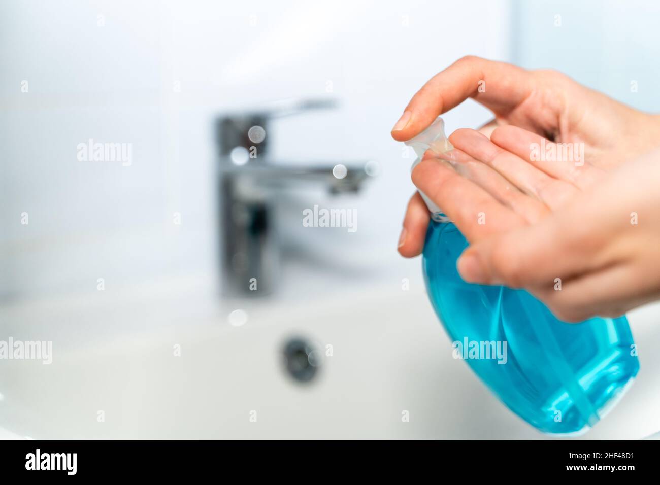 Woman washing her hands at home with antibacterial soap Stock Photo - Alamy