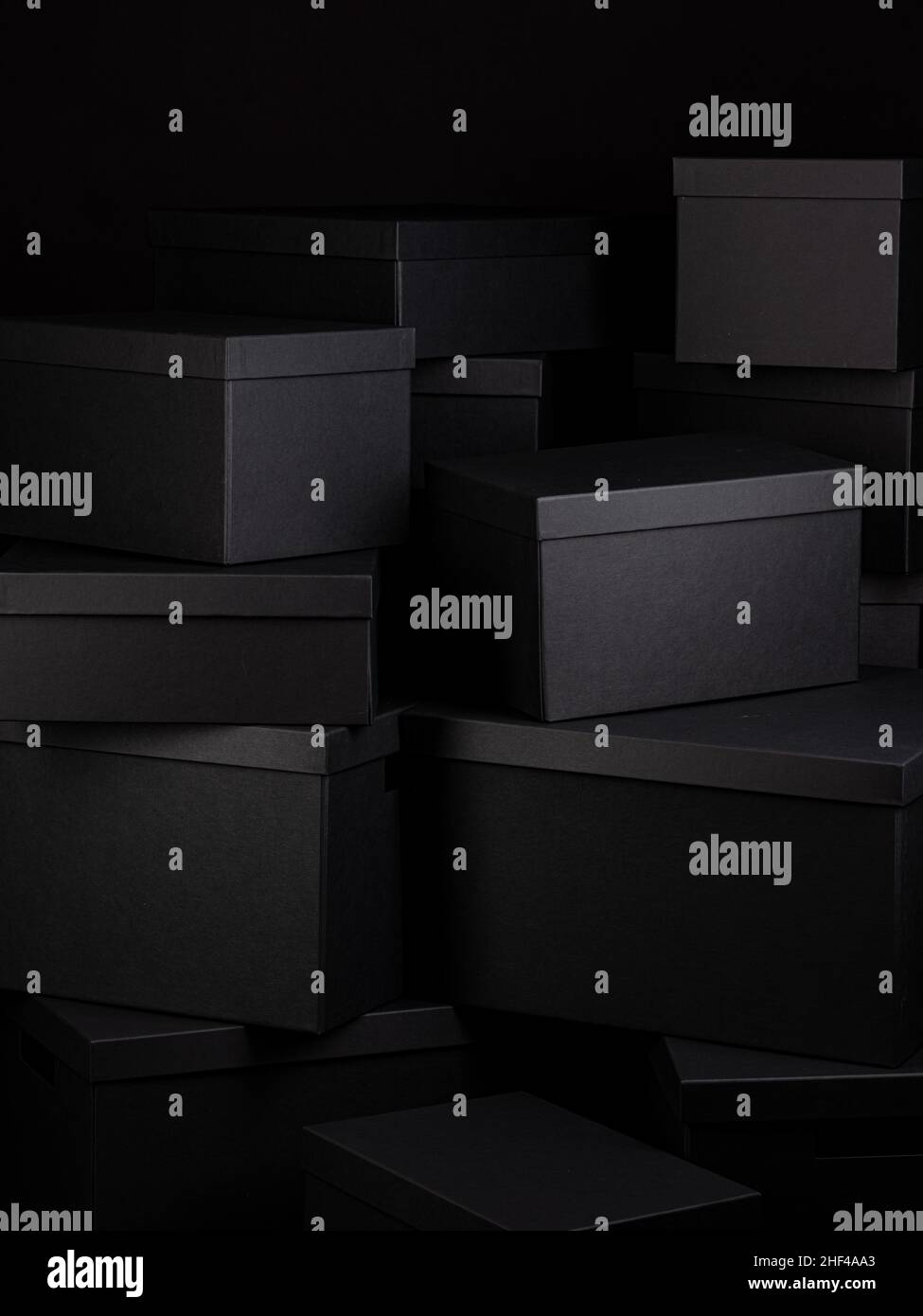 Large dark Stack of Black Boxes in different sizes Stock Photo Alamy