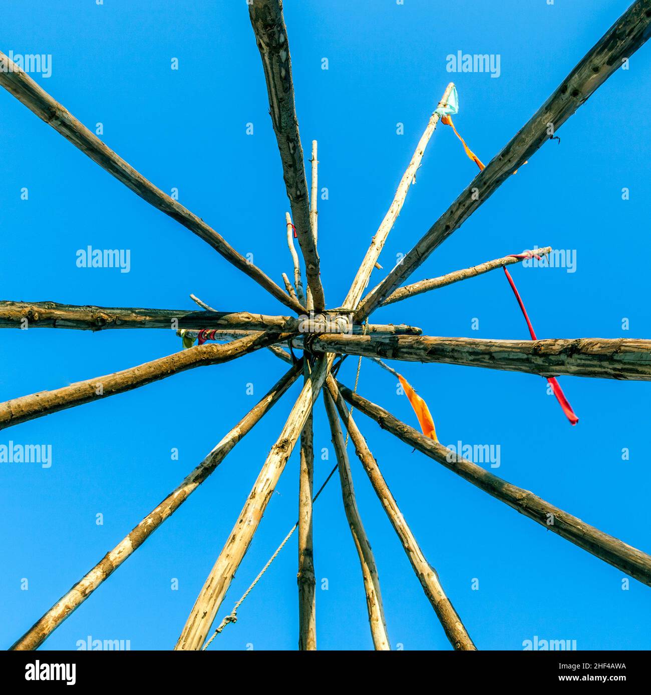Tipee stakes and ribbons shown against a blue sky Stock Photo - Alamy