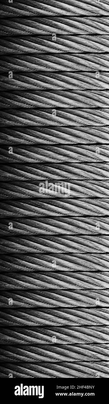 Metal cable winch. Steel rope winch close-up. Strong still background. Stock Photo