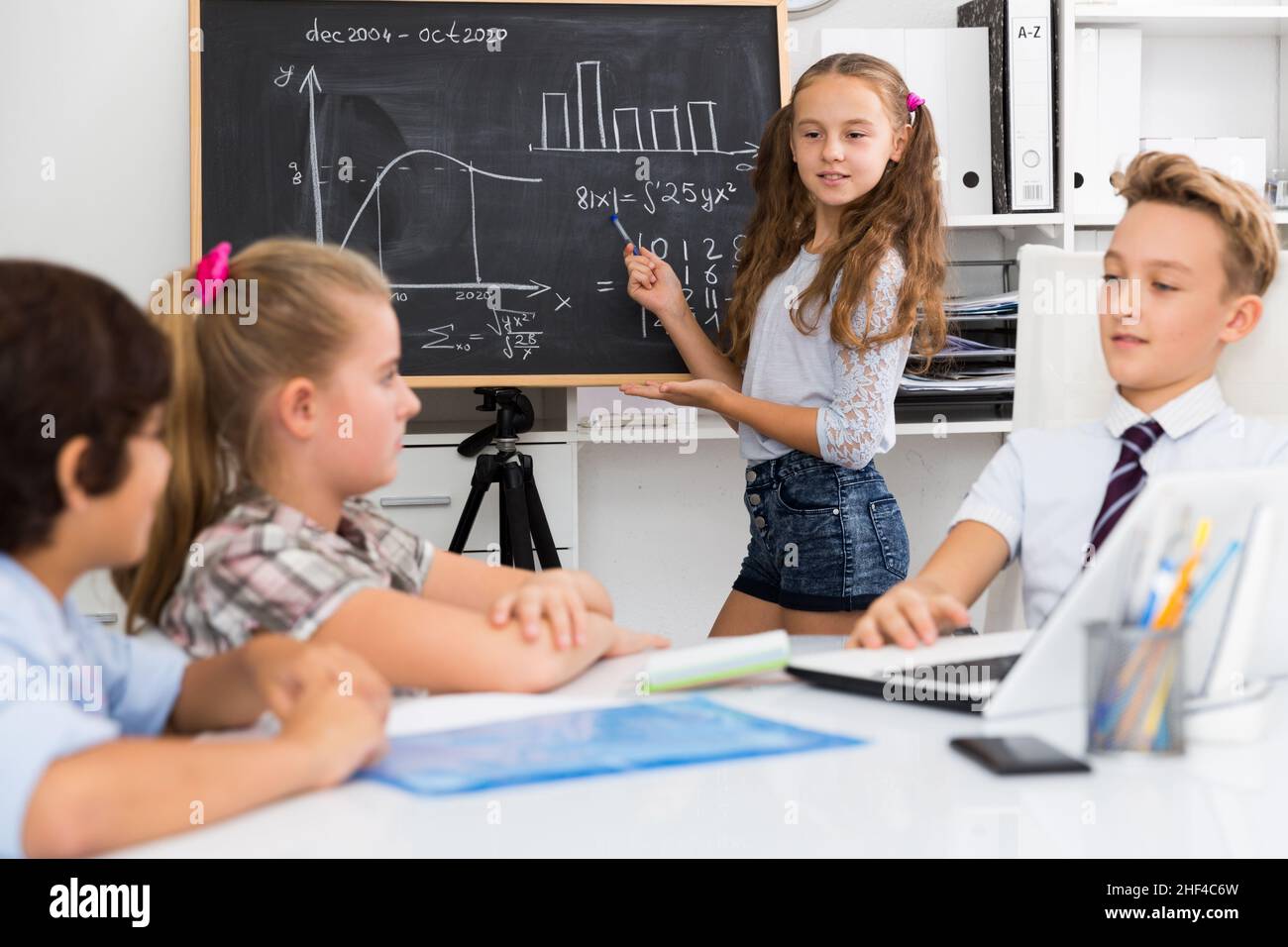 Girl discussing about mathematical formulas Stock Photo - Alamy