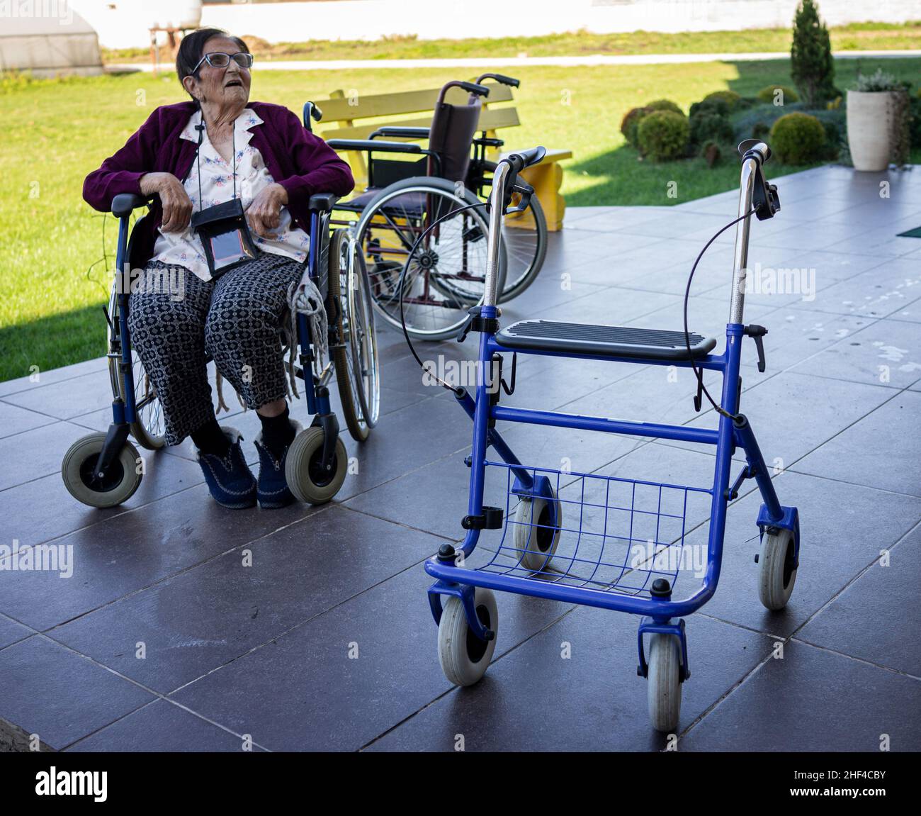 Senior disabled person in wheelchair needs nurse assistance Stock Photo