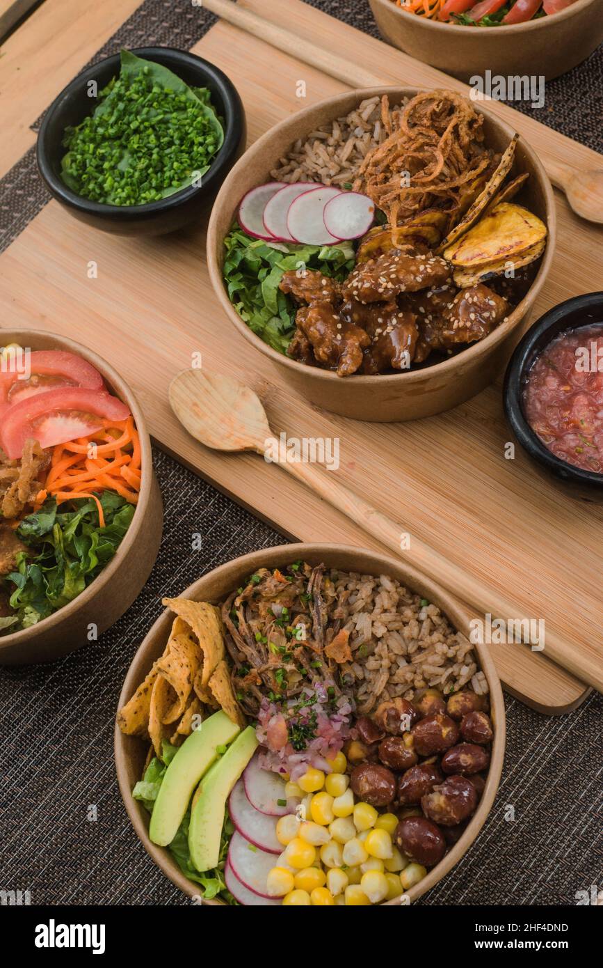 Chicken meal in bowls with vegetables and onion Stock Photo