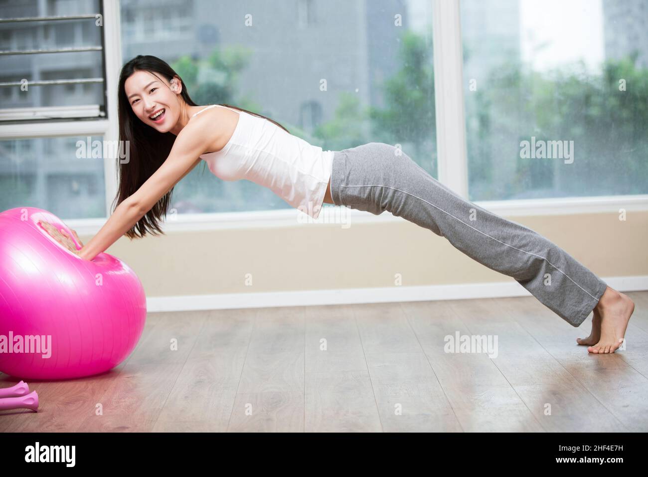 Asian woman doing yoga barefoot hi-res stock photography and images - Alamy