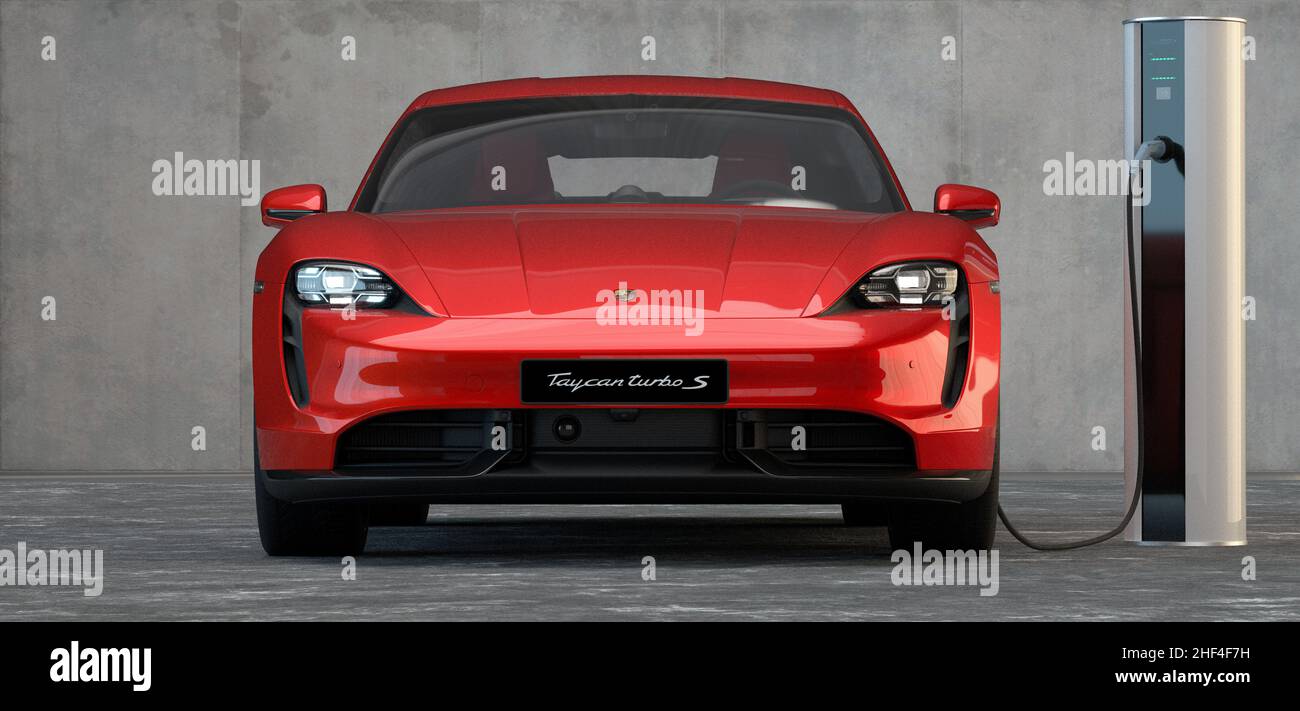 Porsche Taycan connected to charger Stock Photo Alamy