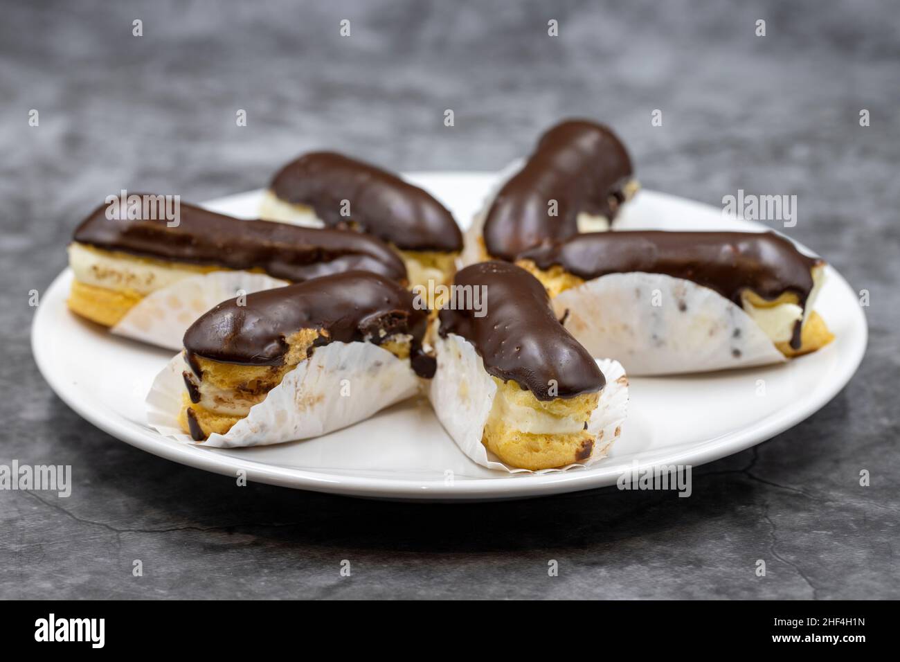 Dark background chocolate eclairs hires stock photography and images