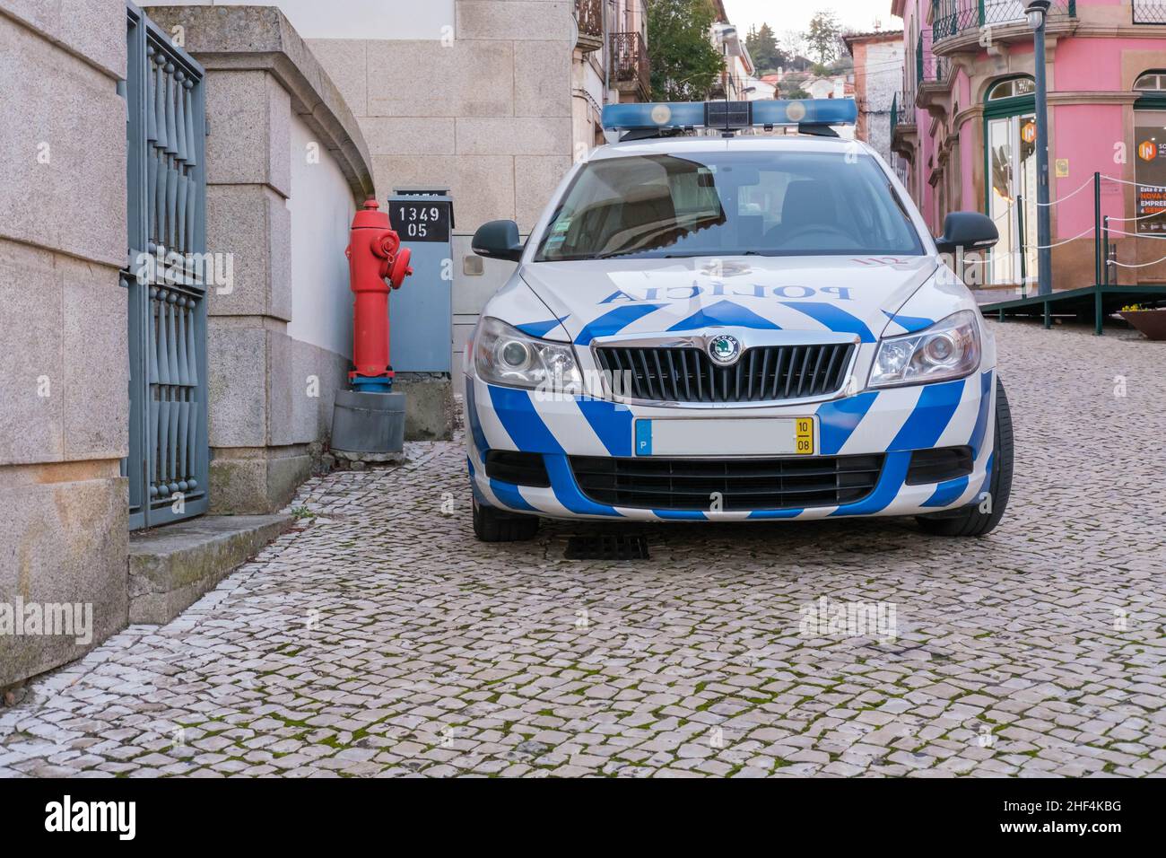 Castelo Branco, Portugal - January 13 2022: Police car parked illegally blocking a fire hydrant on a street in Castelo Branco Portugal Stock Photo