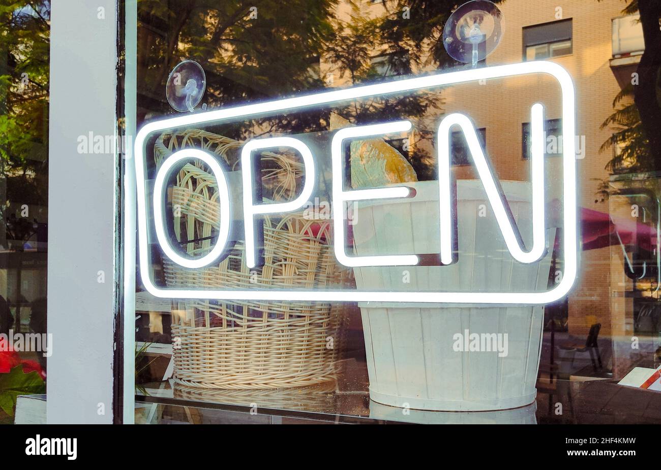 Neon Open sign illuminated in a window of a store Stock Photo - Alamy