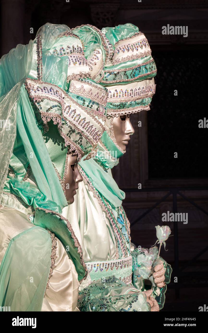 Two women in oppulent historic fancy dress costumes at Venice Carnival, Carnevale die Venezia, Italy Stock Photo