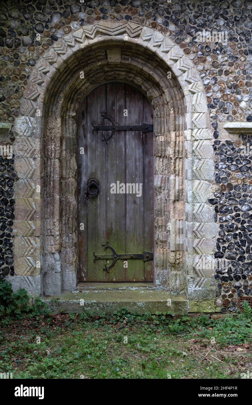 Norman door with chevron zig-zag stone mouldings, Boyton church, Suffolk, England, UK Stock Photo