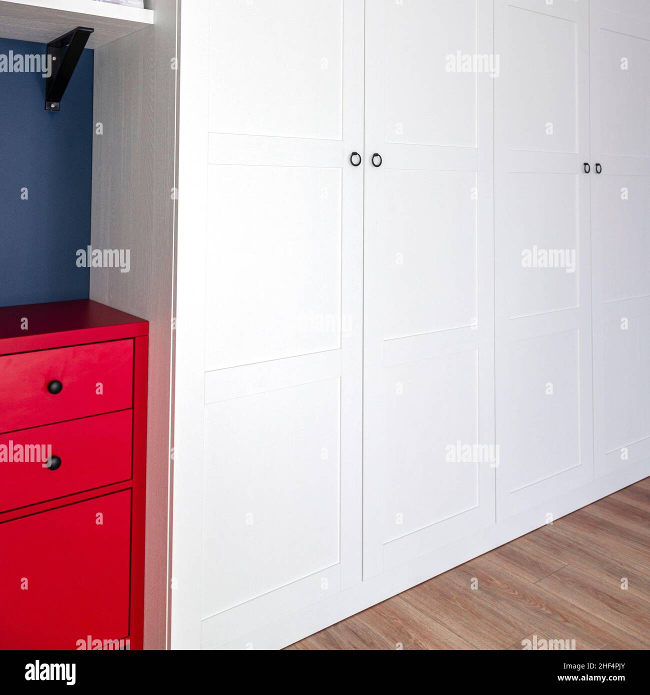 The interior of the apartment in the Scandinavian style. White wardrobe ...