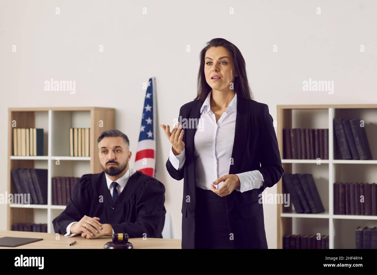 Defense attorney who represents defendant in lawsuit making speech during court trial Stock Photo