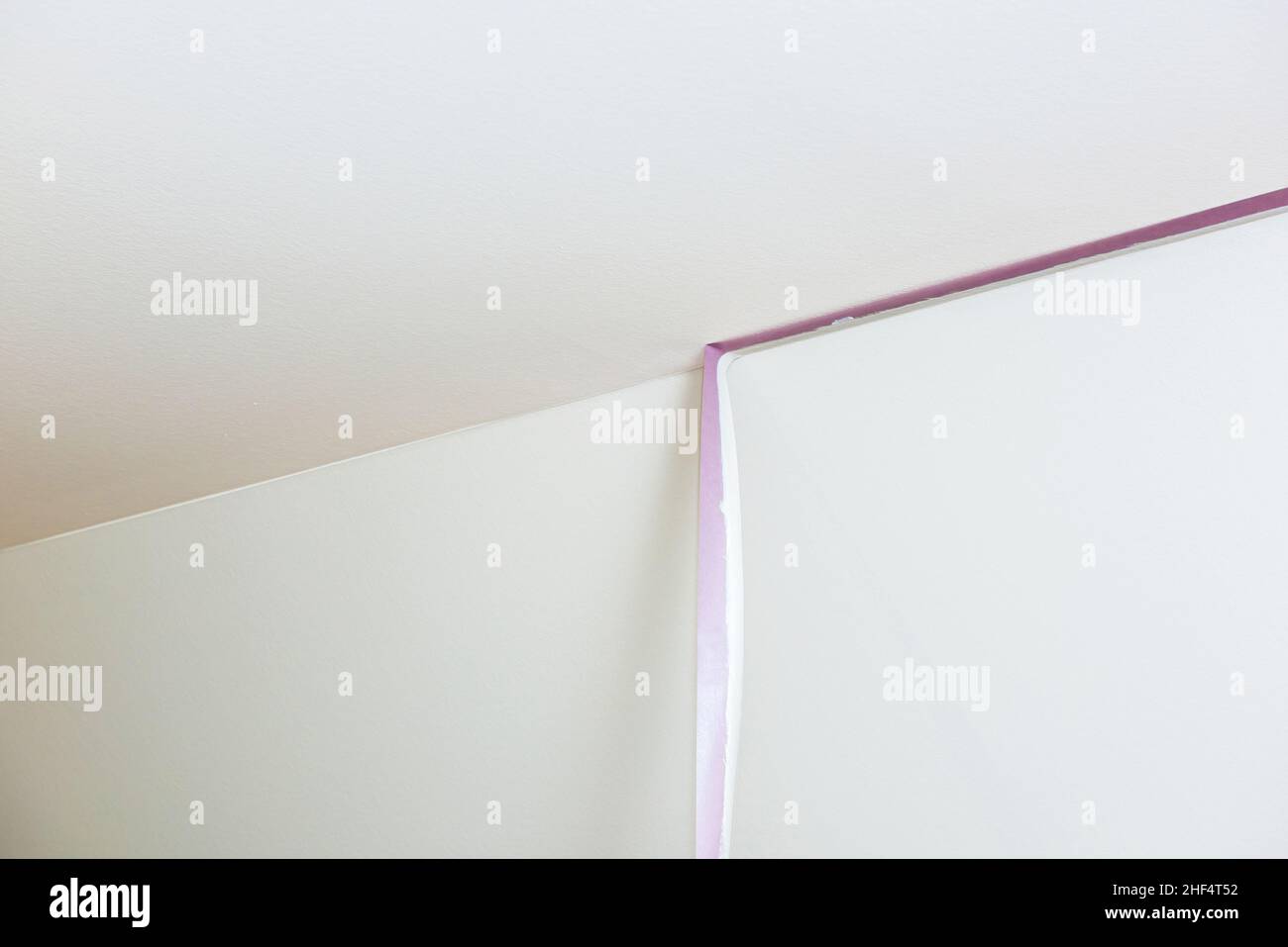 Removal of purple scotch tape from the ceiling after painting the walls