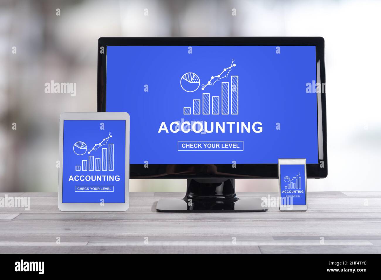 Accounting concept shown on different information technology devices Stock Photo