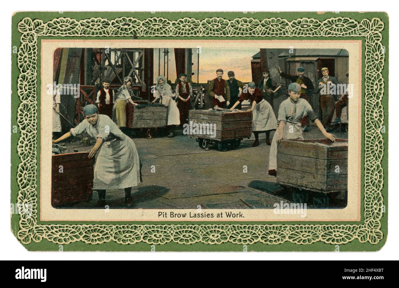 Original early 1900's Edwardian greetings postcard of Lancashire Pit Brow Lassies at work, hauling coal in trucks, Newfoundland No. 1 Colliery, Wigan, Greater Manchester, Lancashire, England, U.K. Photographed in 1907. Published by J. Starr and Sons Ltd. Wigan. Stock Photo