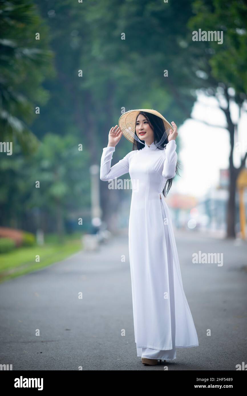 Ho Chi Minh City, Vietnam: Portrait women in white ao dai Vietnam