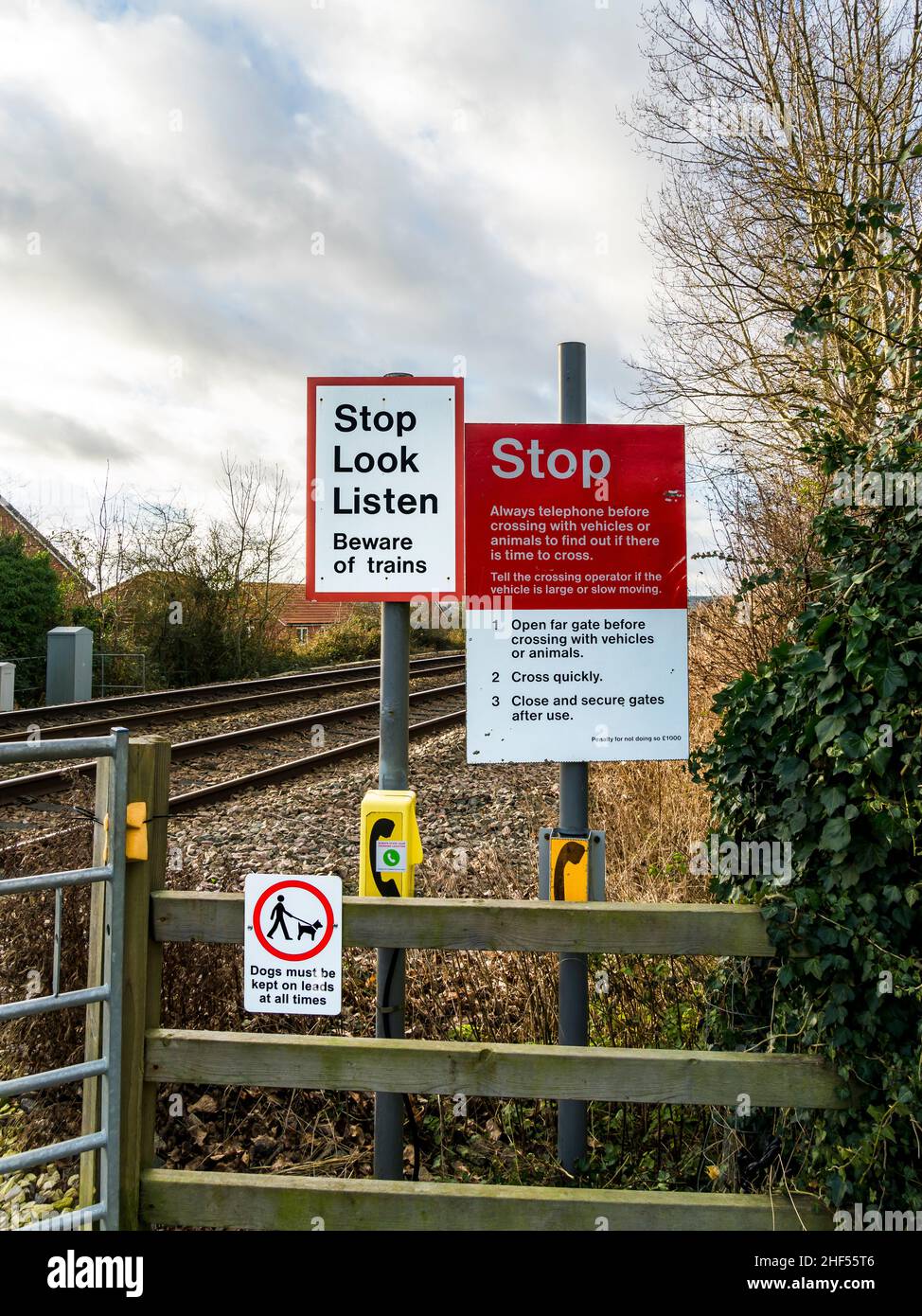 Safety signs and notices at pedestrian operated level crossing Stock