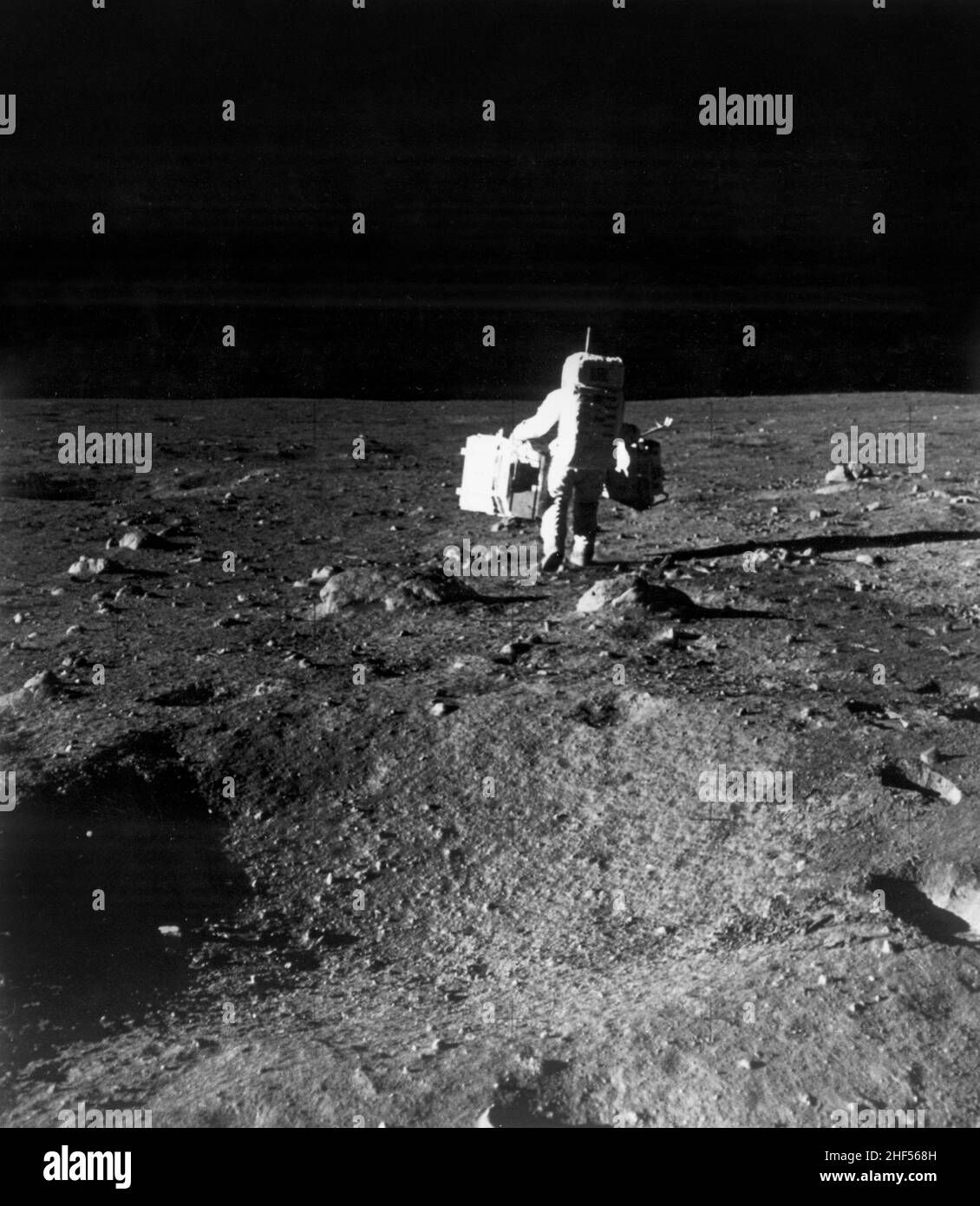 Astronaut Edwin E. Aldrin Jr., lunar module pilot, is photographed with scientific equipment. Stock Photo