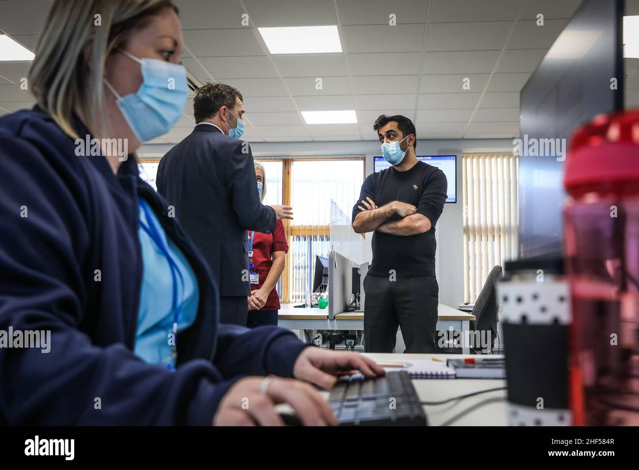 Health Secretary Humza Yousaf (right) speaks to Jim Miller, Chief Executive of NHS 24, during a