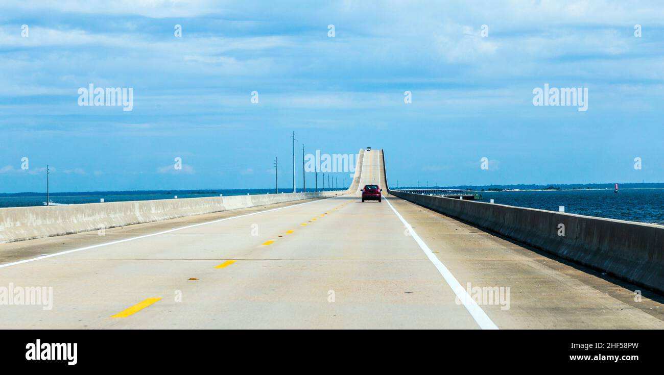 crossing the Dauphin Island Bridge in Dauphin Island, USA. The original