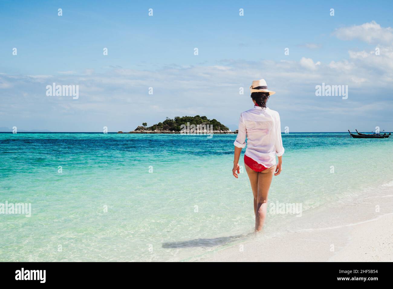 Woman relaxing walking on the beach in tropical island Stock Photo - Alamy
